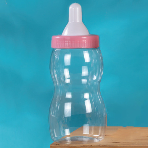 Pink Baby Bottle Bank - 12.5in. This bank features a clear plastic bottle design with a pink cap.