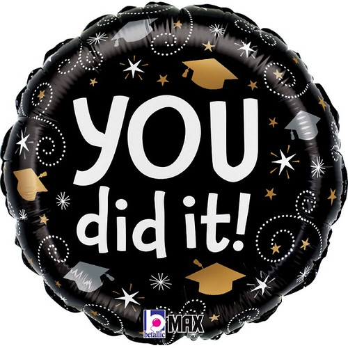 Graduation Swirls Balloon. This circular balloon features a black background decorated with white and gold stars, gold and silver graduation caps, and white dotted swirly accents. One side displays "YOU did it!" in white text. Balloon is approximately 18 inches after inflation.