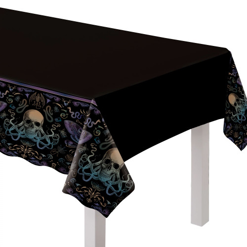 Elevate your Dark Academia Halloween buffet with this stunning table cover. Made from reusable plastic, it features a solid center with end borders adorned with vibrant designs of mystical and mythical creatures.  Size 54" x 102"