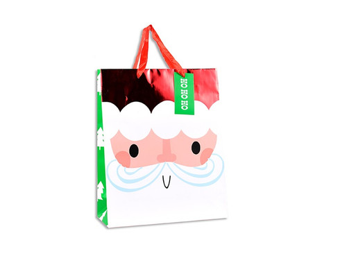 This Small Santa Face Gift Bag adds a cheerful touch to your holiday gifting. This bag measures 7in x 9in, and features a smiling Santa face on the front, with a red foil accent along the top. The sides of the bag are decorated with a festive green and white Christmas tree pattern, completing the joyful design. With a red ribbon handle for easy carrying, this bag is perfect for small gifts and adding a bit of seasonal sparkle to your celebrations.