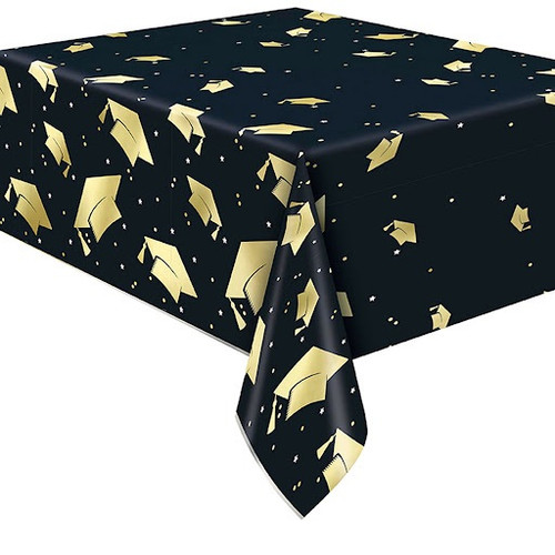 Starry Graduation Plastic Tablecover. Rectangular, featuring a black background adorned with gold graduation caps, tiny white stars, and gold and silver confetti dots. Measures 54in x 84in.