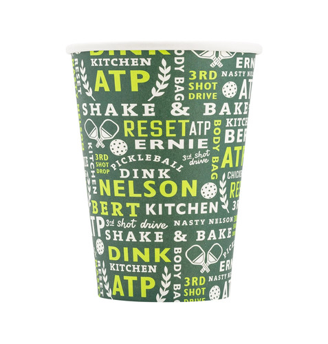 Pickleball Paper Cups. Featuring a white base with a dark green wraparound design, these cups are covered in a fun pattern of pickleball-themed text and icons in white and lighter green. The design includes playful nods to the game with icons like paddles and pickleballs, alongside popular pickleball terms such as “ATP,” “Ernie,” “Nasty Nelson,” “Shake & Bake,” and more. Package includes 8 count cups measuring 12oz.