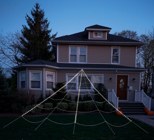 Mega Light Up Yard Web. This decorative web features 210 LED lights and an auto timer. Package includes 1 triangle shape rope web, 1 gutter hook, 5 ground stakes, and a remote control with battery. Lights require 3 AA batteries, not included. Measures 23ft.