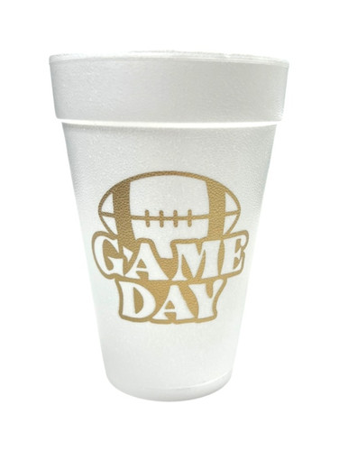 16 oz white Styrofoam Cups, featuring the words "GAME DAY" in gold under the outline of a football. Each sleeve includes 25 durable cups, perfect for hot or cold drinks at your tailgate. 16 oz white Styrofoam Cups, featuring the words "GAME DAY" in gold under the outline of a football. Each sleeve includes 25 durable cups, perfect for hot or cold drinks at your tailgate.