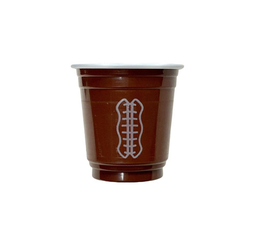 Mini Plastic Football Cups. Made from plastic, these brown cups have a white lace print design to resemble a classic football. Package includes 20 count 2oz cups.