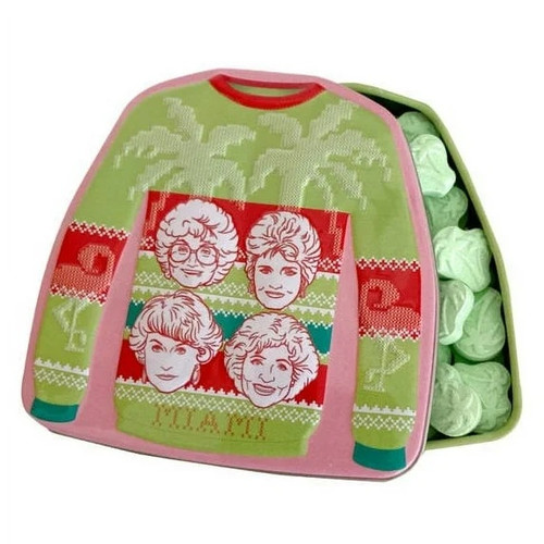 Golden Girls Holiday Candy Tin. This metal tin showcases a holiday sweater with palm trees, the word "MIAMI" and the faces of Sofia, Blanche, Dorothy, and Rose. The palm tree shaped candies inside are flavored sour green apple. Tin Measures 3in x 3in. Net WT 1.2oz.