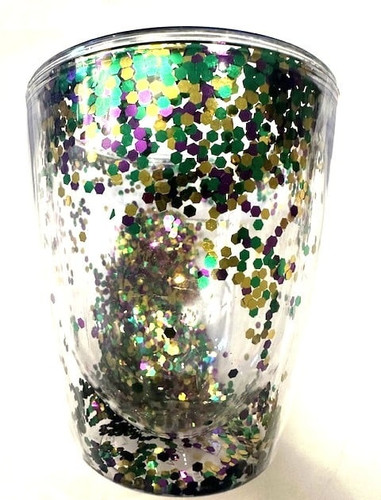 Double Walled Plastic Mardi Gras Cup. This clear plastic cup includes a double wall with shimmery purple, green, and gold confetti. Package includes one cup measuring 4.5in x 4in.