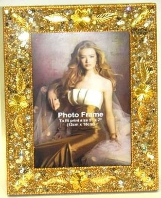 Mardi Gras Gold Leaves Frame. This frame features gold leaf accents, sequins, and gold beaded detail. Measures 9in x 7in and holds a 5in x 7in photo.