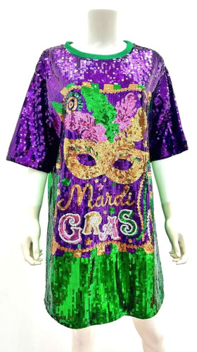Mardi Gras Sequin T Shirt Dress. This dress long sparkly t shirt features a design of a gold eye mask with feathers above the words "Mardi GRAS." One size fits most.