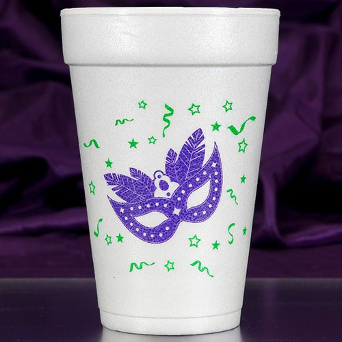 Mardi Gras Mask Styrofoam Cups. 16 oz white Styrofoam Cups, featuring a purple feathered eye mask surrounded by green confetti. Each sleeve includes 10 durable cups, perfect for hot or cold drinks at your holiday gathering. Add a festive touch with these must-have cups.