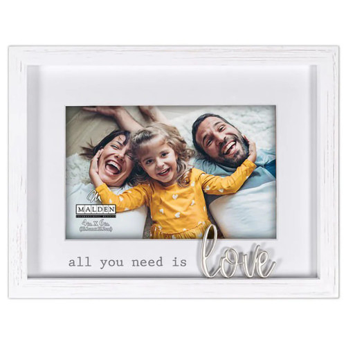 All You Need is Love Picture Frame. This white wooden frame has a white mat around the space for a photo with the gray printed text "all you need is" at the bottom and "love" in metal embedded in the frame positioned at the end. Hang it on the wall or sit it on a table. Measures 8.5in x 6.5in and holds a 4in x 6in photo.