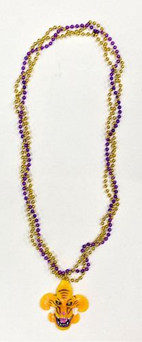 Purple and Gold Twist Bead Necklace with Tiger Fleur de Lis. This necklace features strands of purple and gold beads twisted around each other with a pendant of a Fleur de Lis with a tiger face. One size fits most.
