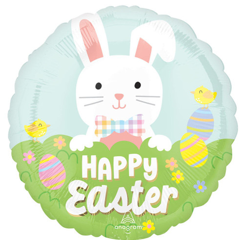Bunny Bliss Balloon. This circular balloon features a blue sky over green grass with colorful eggs and yellow chicks, as well as "HAPPY Easter" in white text. A cheerful white bunny with one lopsided ear and wearing a colorful gingham bow around its neck peeks over the grass. Balloon is approximately 17 inches after inflation.