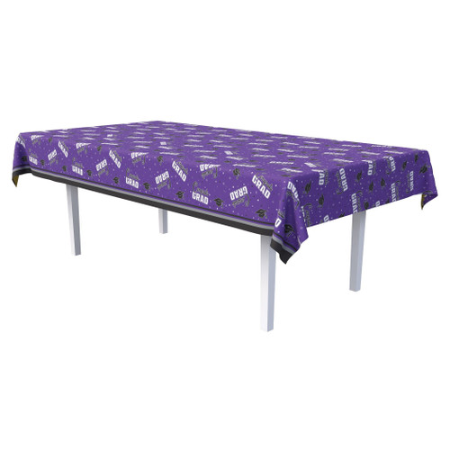Congrats Grad Plastic Tablecover - Purple. This rectangular plastic tablecover features a purple background, decorated with a pattern of white and black star confetti, along with black graduation caps and groups of "Congrats" in black script over "GRAD" in white block text. Measures 54in x 108in.