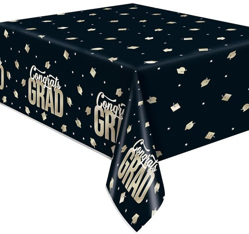 Classy Grad Plastic Tablecover. This black, rectangular plastic tablecover features a pattern of white stars and gold foil grad caps. A pattern of "Congrats" in white script sitting above "GRAD" in gold foil text repeats along the borders. Measures 54in x 84in.