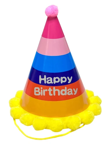 Happy Birthday Bright Rainbow Pom Pom Cone Hat. This printed cardstock cone hat features a horizontal stripes in multiple colors and "Happy Birthday" in a simple gray font. On the top is a pink pom pom and along the rim are yellow pom poms, and it includes a yellow elastic band. One size fits most. Measures about 7in tall.