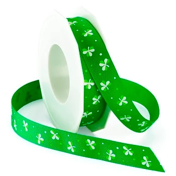 Irish Clover Ribbon. This green polyester grosgrain ribbon features a printed pattern of three leaf clovers and dots in white and a lighter green. Measures 7/8in x 4yds.