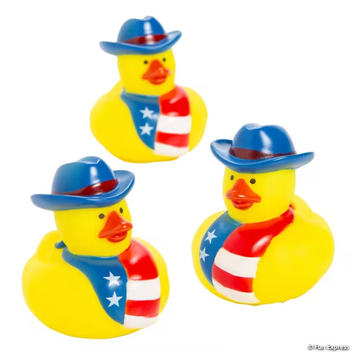 Patriotic Cowboy Rubber Duck. This classic little yellow vinyl duck features a cowboy hat in blue with a red band and a bandana in red, white, and blue with stars and stripes. Package includes 1 count duck measuring 2in.