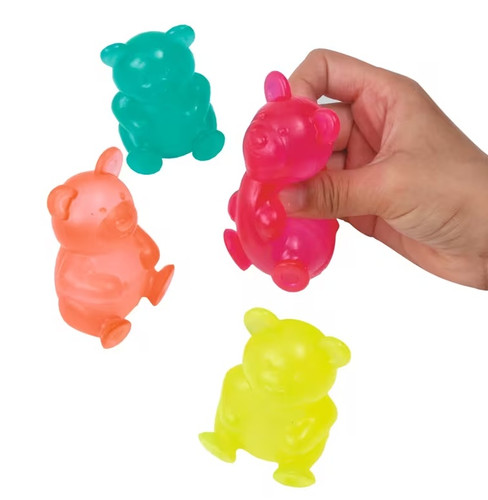 Squishy Gummy Bear Toy. Available in pink, yellow, red, or turquoise, these adorable translucent rubber bears are super squishy. Desired color not guaranteed. Package includes 1 count toy measuring about 2.5in.