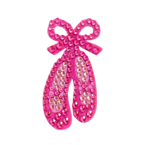Stickerbeans Rhinestone Sticker - Ballet Slippers. This sparkly sticker features two pink ballet slippers tied together with a bow. Package includes 1 count sticker measuring about .7in x 2in.