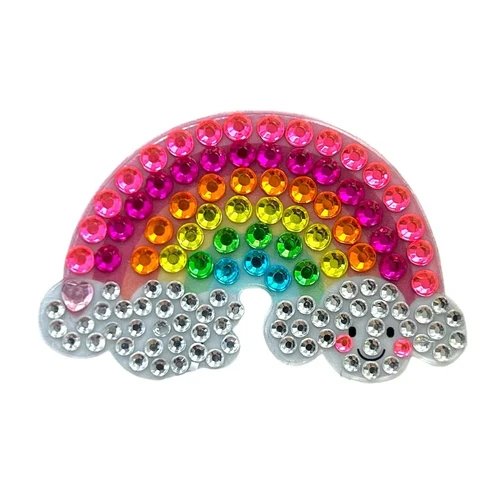 Stickerbeans Rhinestone Sticker - Happy Rainbow. This sparkly sticker features a rainbow with a smiley face on the cloud on the right side. From the Care Bear collection. Package includes 1 count sticker measuring about 1.8in x 1.25in.