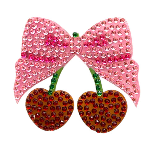 Stickerbeans Rhinestone Sticker - Cherry Bow. This sparkly sticker features a couple of red cherries on green stems and a large pink bow. Package includes 1 count sticker measuring about 2in x 1.75in.