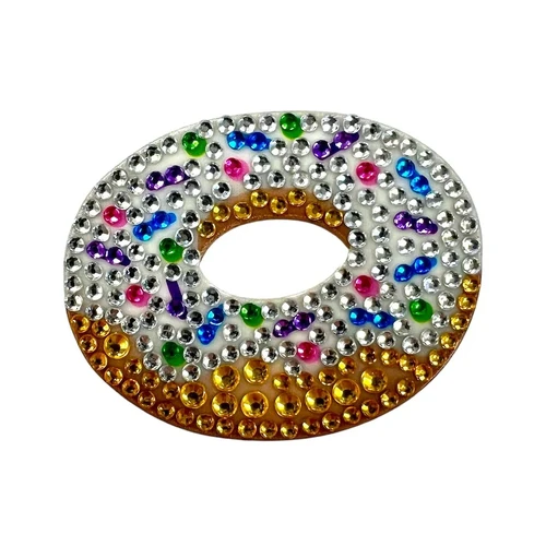 Stickerbeans Rhinestone Sticker - Vanilla Donut. This sparkly sticker features a donut shape made of silver and gold rhinestones, covered in multicolor rhinestones for sprinkles. Package includes 1 count sticker measuring about 1.9in x 1.75in.