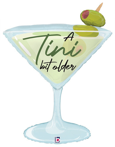 This A Tini Bit Older Balloon is shaped like a martini glass with olives. Centered is "A Tini bit older" in black and green script. Balloon is approximately 35 inches after inflation.