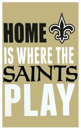 Home is Where the Saints Play Wall Plaque. This medium density fiberboard plaque features a muted gold color with "HOME IS WHERE THE SAINTS PLAY" in black and white text, accented with a black Saints fleur de lis logo. Measures about 22in x 13in x 1in.