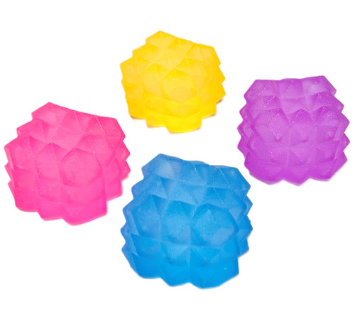 Squishy Cube Toy - Geometric. Available in pink, orange, blue, or purple, these cube shaped pieces are super squishy, slow to regain its shape. They have a texture of geometric knobs. Desired color not guaranteed. Package includes 1 count toy measuring about 2.25in x 1.5in.