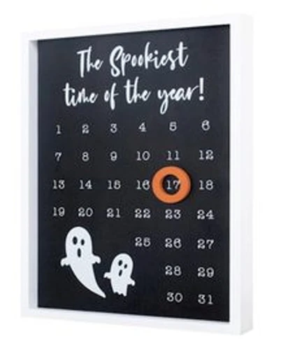 Spookiest Time of the Year Framed Calendar. This shadowbox white frame features a black calendar with "The Spookiest time of the year!" in white script above the days leading up to the 31st, as well as a couple of cartoon ghosts. It includes a sawtooth hanger to display on your wall and an orange, circular magnetic marker to place around the current day. Measures 9.75in wide x .5in thick x 11.75in tall.