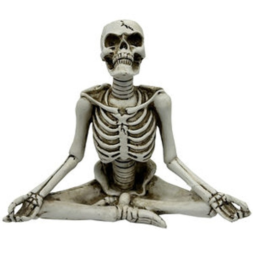 Lotus Pose Sculpture Decoration. This resin sculpture features a white skeleton in a meditative yoga lotus pose, perfect for a shelf, table, or mantel. Measures 5.75in wide x 5.5in tall.