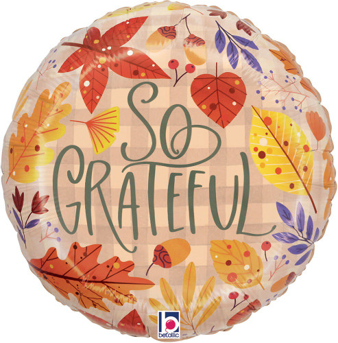 So Grateful Fall Leaves Balloon. This rustic brown gingham, circular balloon features "So Grateful" in green text, surrounded by sprigs of colorful fall foliage. This balloon will inflate to approximately 18 inches.