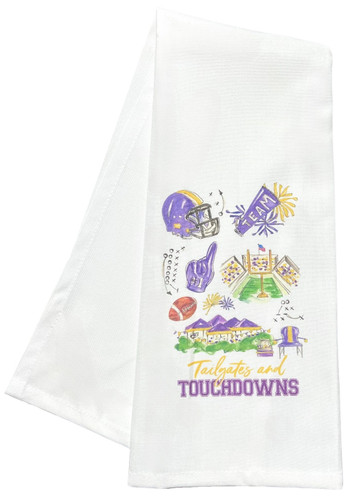 Purple & Gold Tailgates and Touchdowns Kitchen Towel. This white cotton towel features a colorful print of iconography such as a helmet, foam finger, stadium, and tailgate set up above "Tailgates and TOUCHDOWNS" in purple and gold text. Machine washable. Measures 17in x 30in.