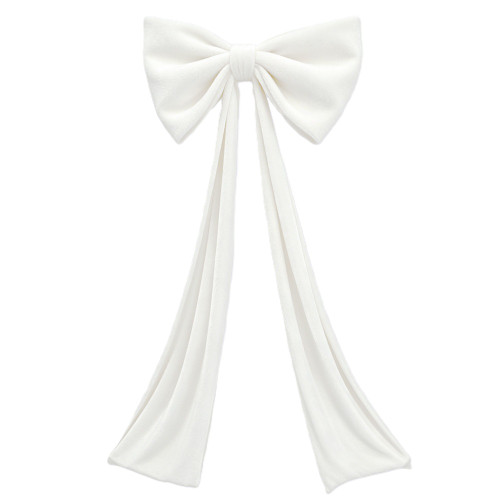 Giant White Velvet Bow. This large white velvet bow, reinforced with soft foam for a full and plush shape, features long tails for extra flair. For indoor use only. Hanging implement not included. Measures 32in x 18in with 72in tails.