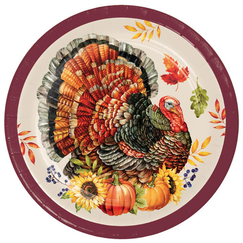 Bountiful Bird Luncheon Plates. Featuring a burgundy trim, these round paper plates have an ivory background and centered is a turkey sitting on a fall bouquet surrounded by falling leaves. Perfect for Thanksgiving dinners or autumn gatherings, they bring a festive and stylish touch to any fall table. Package includes 8 count plates measuring 8.75in.