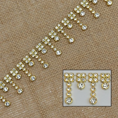 Rhinestone Wave Trimming - Gold. This trim of tiny clear lines of rhinestones, alternating in 12mm and 23mm lengths, is connected by thin gold plastic and thread. Measures 23mm x 5yds.