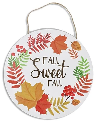 Harvest Round Hanging Plaque - Fall Sweet Fall. Available in two designs, this white, round medium density fiberboard features a burlap string for hanging. Choose between a trim of fall foliage around "FALL Sweet FALL" in gold or "gather" in gold script above a group of pumpkins. Desired style not guaranteed. Package includes 1 count decoration measuring about 11.7in.