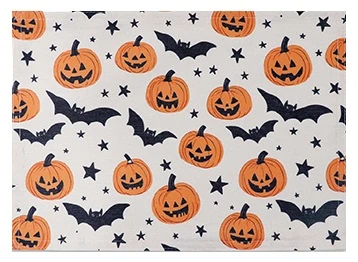 Halloween Printed Fabric Placemat. This white cotton and polyester placemat features a print of orange Jack O Lanterns and black bats and stars. The underside is white. Package includes 1 count placemat, measuring 18in x 13in.
