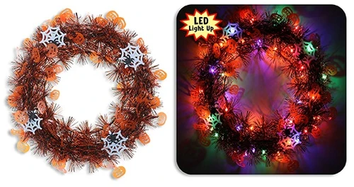 Halloween Light Up Tinsel Wreath - Orange and Black. Available in orange and black pumpkin tinsel with white felt spiderwebs or black and silver skull tinsel with orange felt spiders, this wreath features a strand of 20 LEDs on a circular plastic frame. Batteries included. Desired style not guaranteed. Package includes 1 count wreath measuring 11.5in