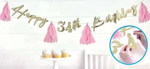 Blush Birthday Gold Foil Customizable Banner. This gold foil banner with blush pink tissue paper tassel spacers features "Happy Birthday" in script with numbers to customize the age. Other decorative props not included. Assembly required. Package includes 35 count diecut letters and numbers measuring from 2.25in - 7in, 4 count tassels measuring 9in, twine measuring 12ft, and 1 plastic needle.