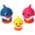 Baby Shark Family Fun Decoset. Package includes 1 count 2in x 2in x 2.8in pink Mommy Shark, 1 count 2in x 2in x 2.8in blue Daddy Shark, and 1 count 1.6in x 1.6in x 2.25in yellow Baby Shark.