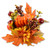 Harvest Pumpkin Tabletop Decoration. This piece includes fabric leaves in fall colors as well as a pumpkin and berries. Measures about 10in.