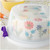 Round Cake Caddy. This plastic caddy with a reversible base can carry a 10in x 5.5in round cake, or 13 standard cupcakes. Measures 15in x 7in.