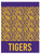 Purple & Gold Tiger Stripe Plastic Table Cover. This rectangular plastic cover features a pattern of deep yellow with purple stripes and purple edges with "TIGERS" repeating in deep yellow text. Table cover measures 54in x 108in.