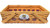 LSU Woven Basket - X Large. This orange tinted wooden basket features a single purple stripe along the side and a white ceramic medallion with an LSU Tiger logo. Measures about 18in long x 12.75in wide x 5.25in tall without handles.