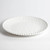 Beaded Pearl Melamine Dinner Plate. This sturdy, reusable hard plastic plate features a creamy white color with a raised beaded border. Package includes 1 count plate measuring 11in.