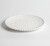 Beaded Pearl Melamine Luncheon Plate. This sturdy, reusable hard plastic plate features a creamy white color with a raised beaded border. Package includes 1 count plate measuring 9in.