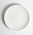 Beaded Pearl Melamine Luncheon Plate. This sturdy, reusable hard plastic plate features a creamy white color with a raised beaded border. Package includes 1 count plate measuring 9in.