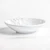Melamine Marble Bowl. This sturdy, reusable, slightly organically round, hard plastic bowl features a white marble finish, perfect for salads. Package includes 1 count bowl measuring about 8in in diameter x 1.9in tall.